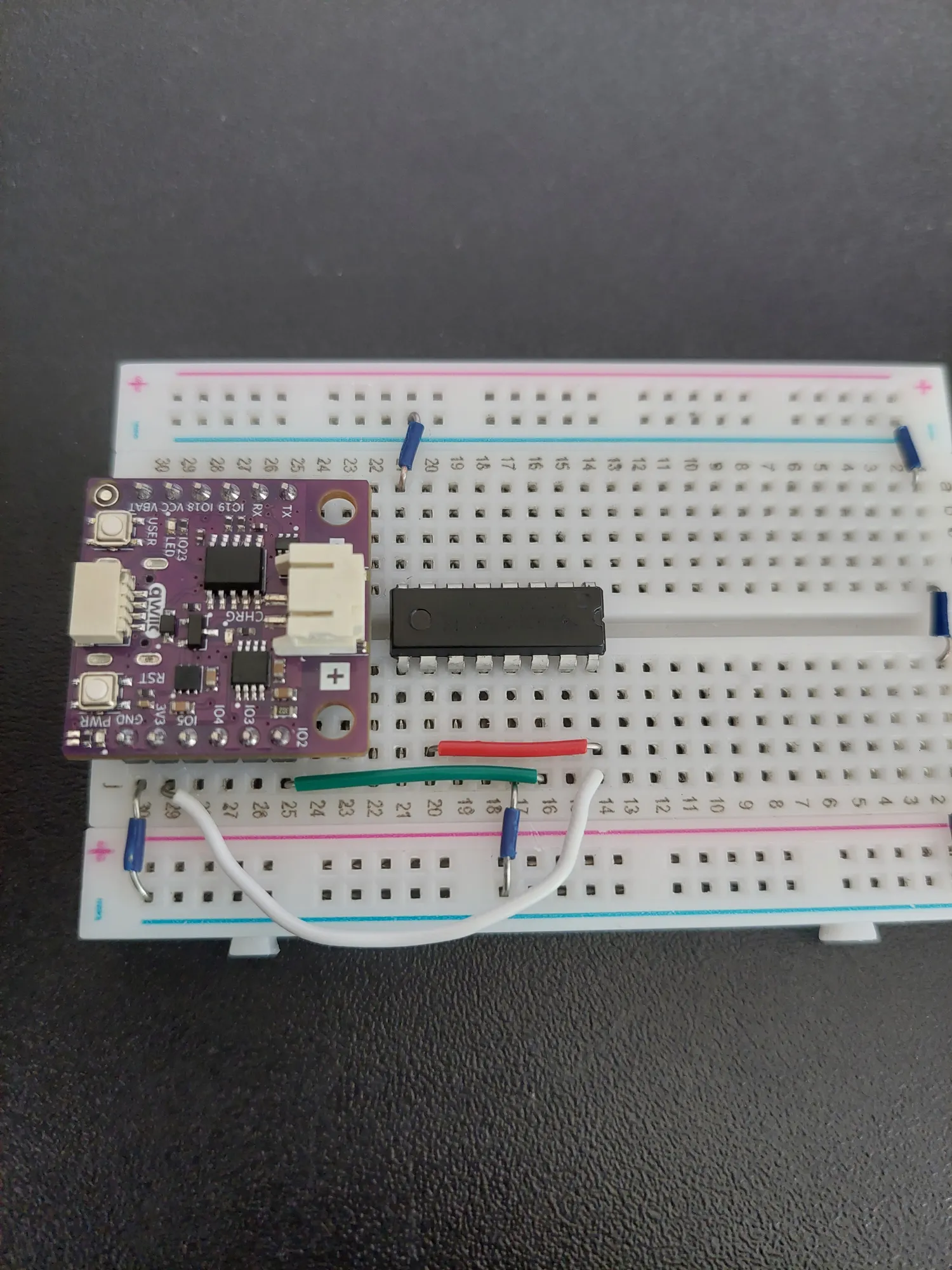 Dark green wire connecting IO2 to the shift register data pin