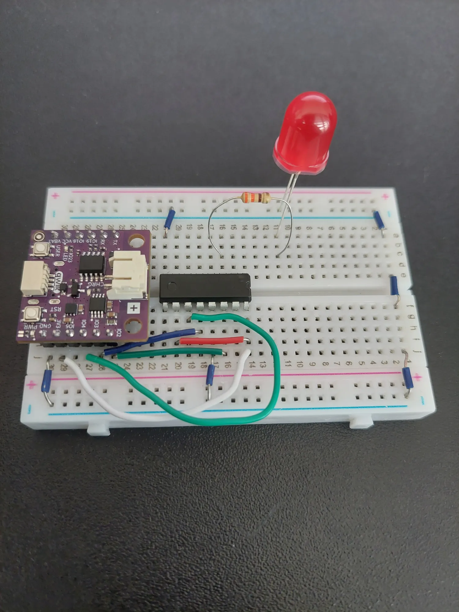 Red LED with its anode in row 11 and its cathode bent into the ground rail